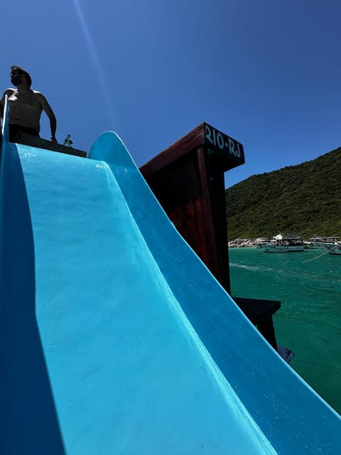 Arraial do Cabo: Boat Trip with Waterslide - Swimming around the boat at Praia do Forno
