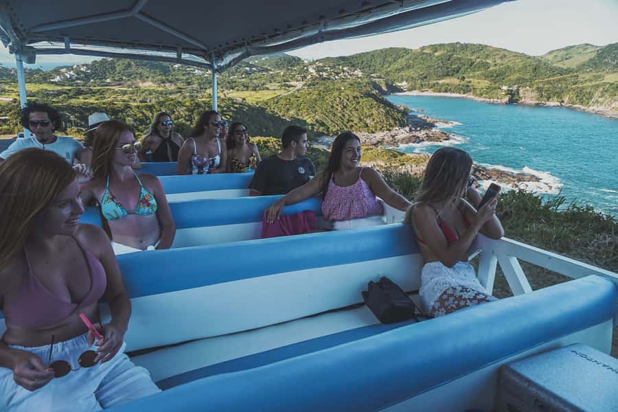 Buzios: City Tour by Trolley with 12 Beaches and Pickup - Riding the open-sided vehicle
