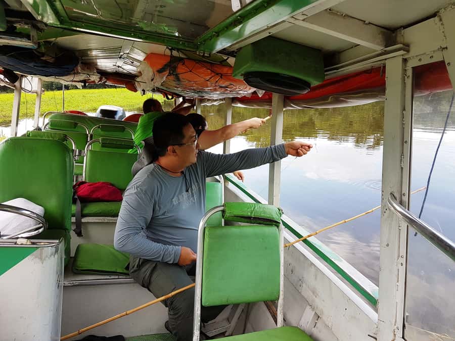 Manaus: Piranha Fishing and Alligator Watch Evening Tour - Waiting for darkness on the river